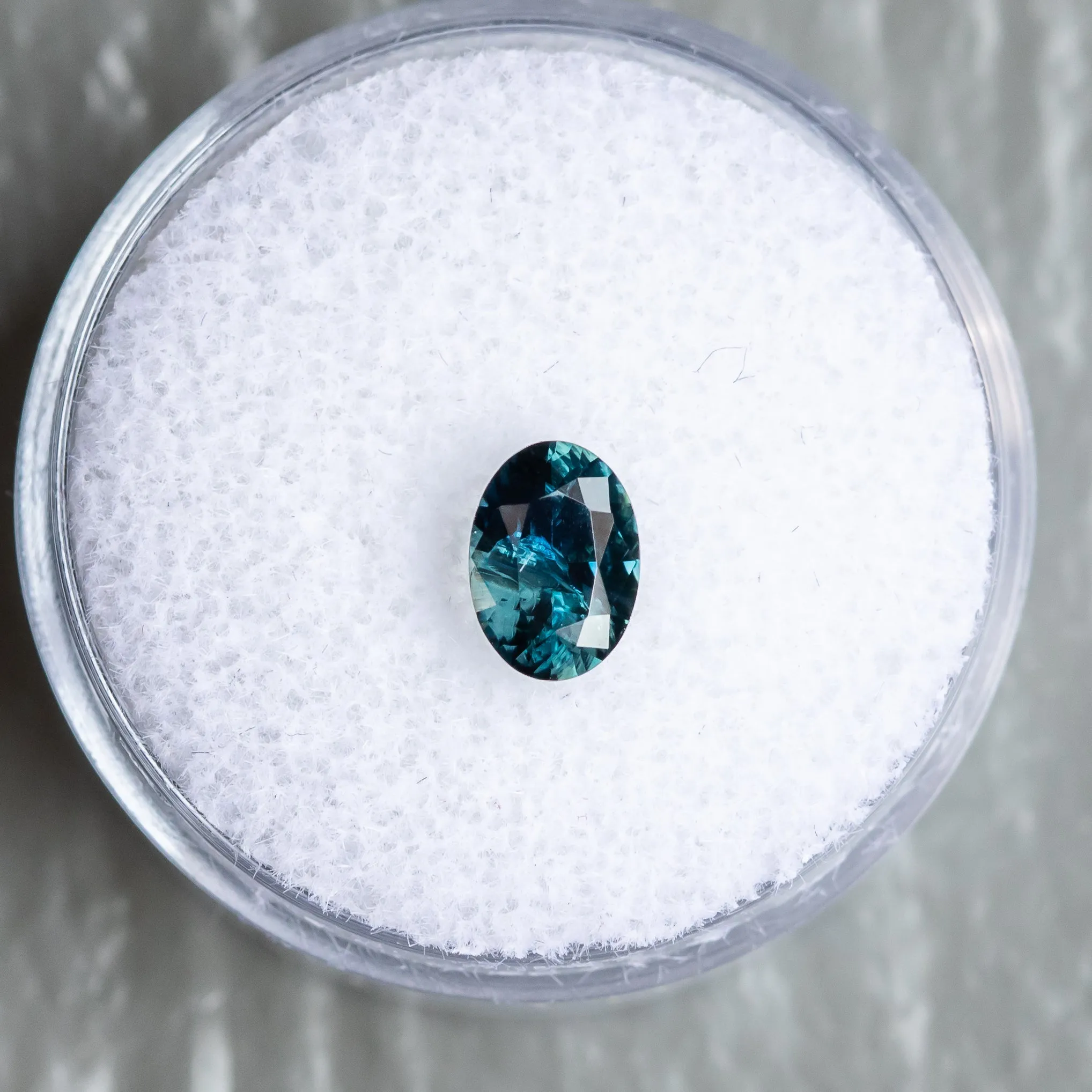 0.93CT OVAL NIGERIAN SAPPHIRE, TEAL BLUE, 7.01X5.04X3.40MM, UNTREATED