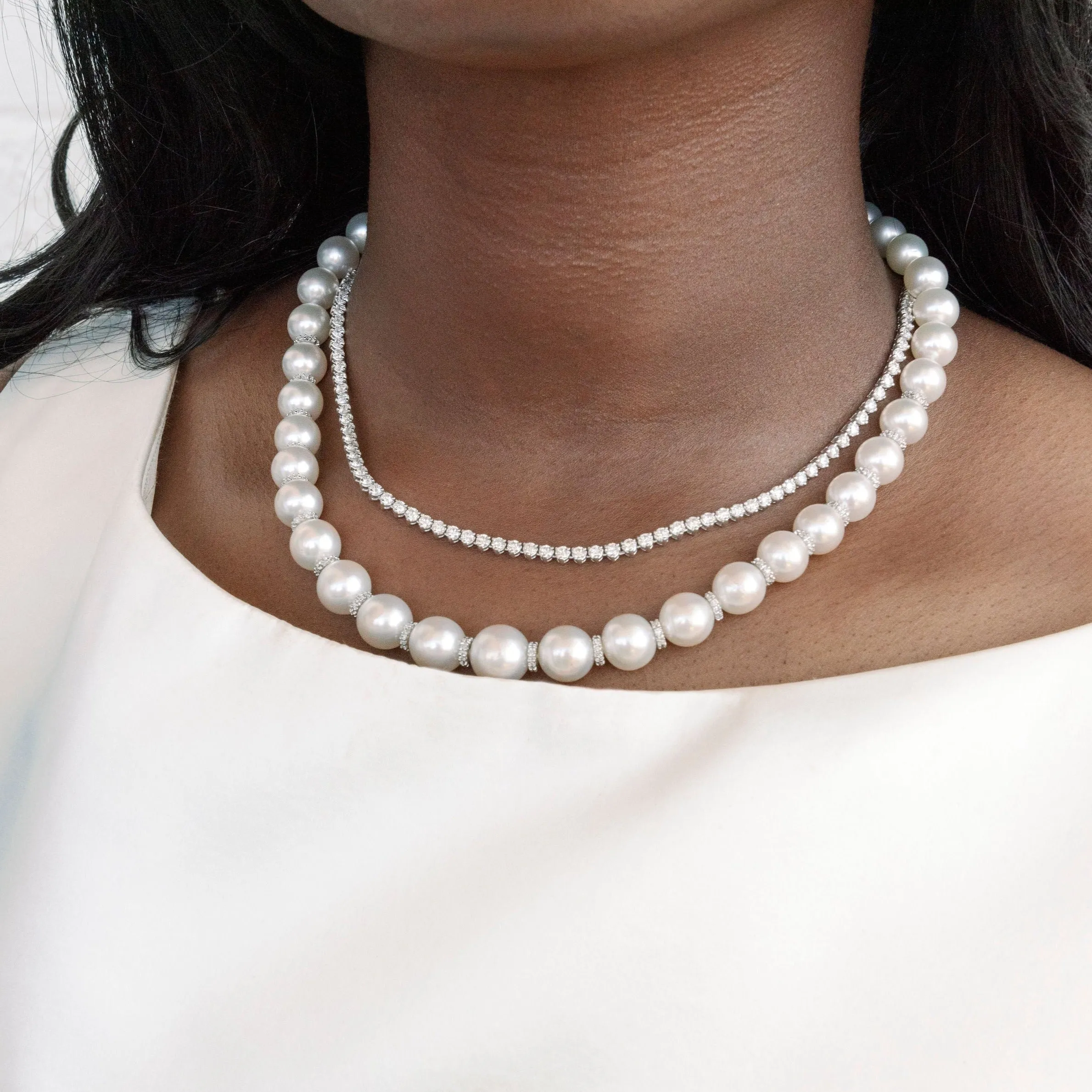 16-INCH SOUTH SEA GRADUATED PEARL AND DIAMOND RONDELLE NECKLACE